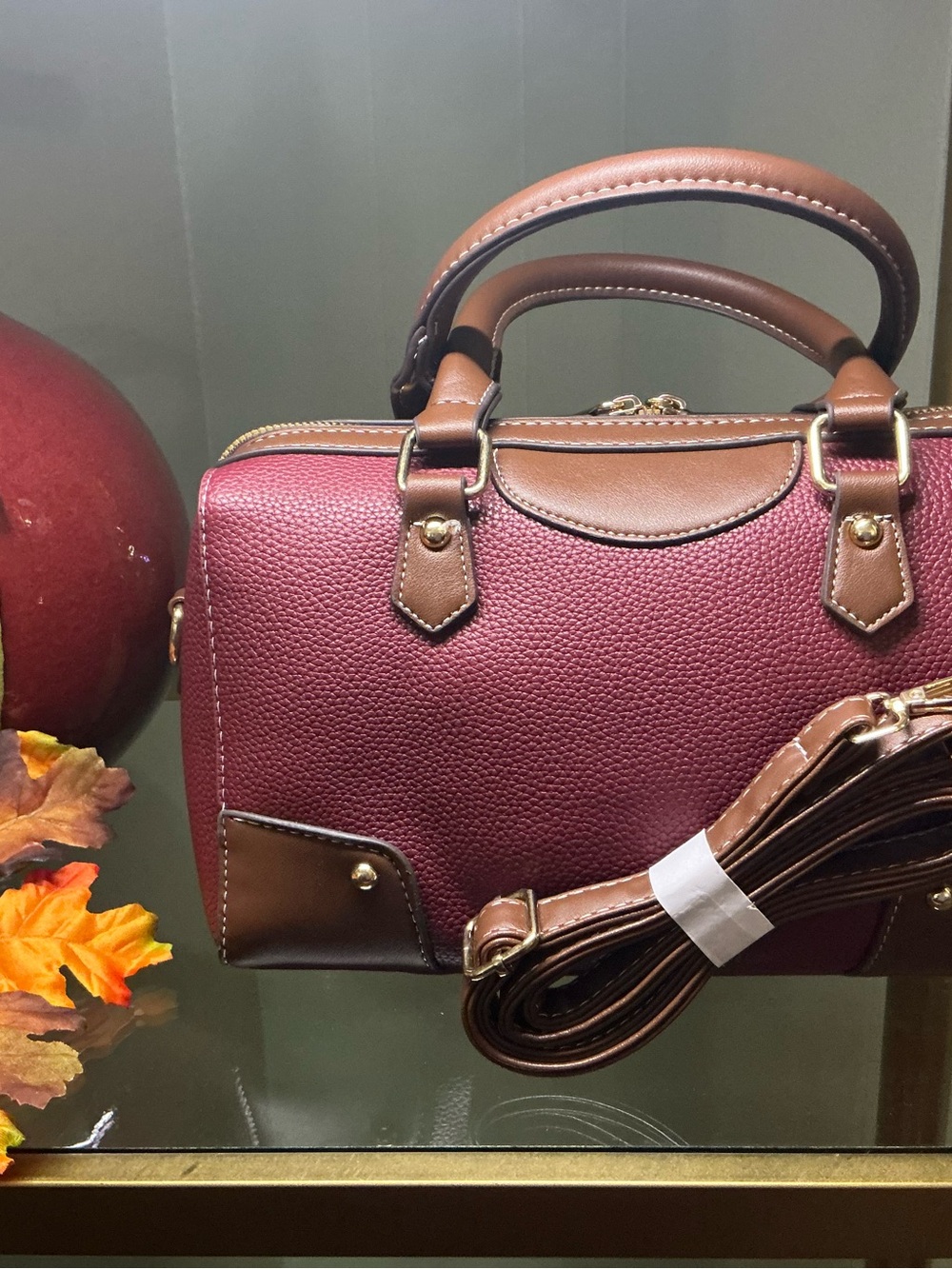 Burgundy Satchel Handbag with Brown Trim and Detachable Strap